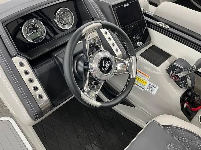 Slide: The Image of 2025 Barletta Lusso 25UC boat dashboard with modern steering wheel and control panel. - 20