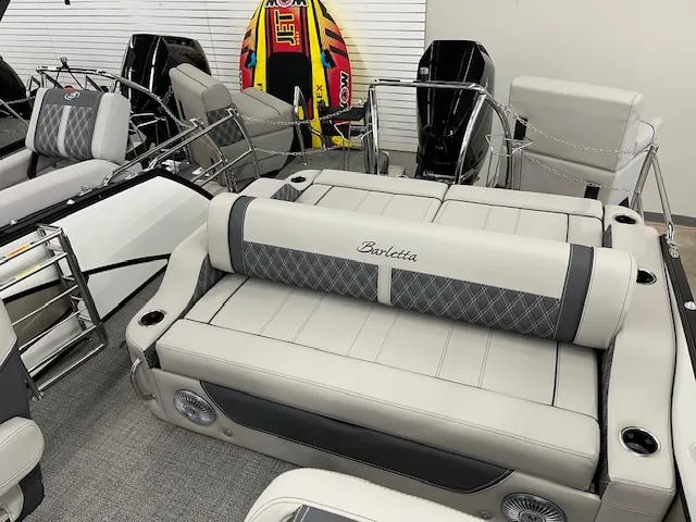 Slide: The Image of 2025 Barletta Lusso 25UC pontoon boat with luxurious seating and modern design. - 21