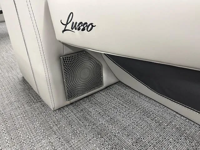 Slide: The Image of 2025 Barletta Lusso 25UC boat interior with speaker and elegant upholstery. - 24