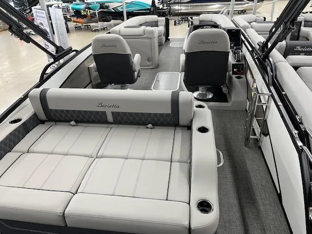 Slide: The Image of 2025 Barletta Lusso 25UC pontoon boat interior with luxurious seating and modern design. - 4