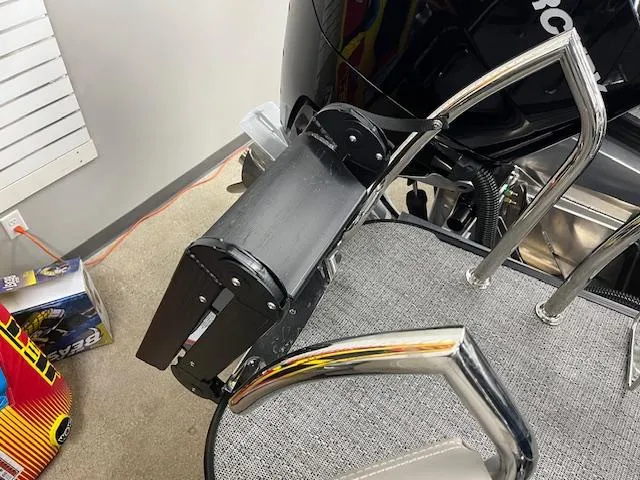 Slide: The Image of 2025 Barletta Lusso 25UC boat ladder and motor detail in a showroom setting. - 7