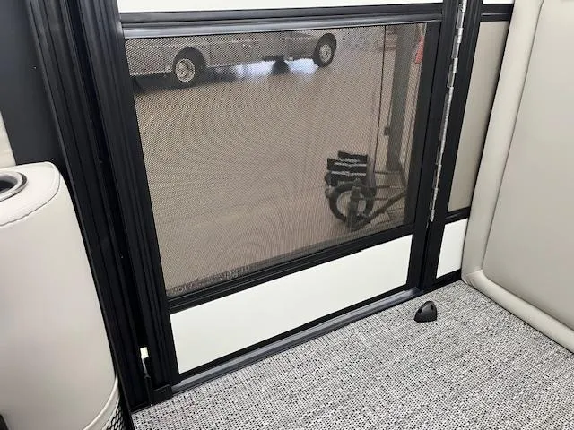 Slide: The Image of Interior view of 2025 Barletta Lusso 25UC with mesh door and carpeted floor. - 8
