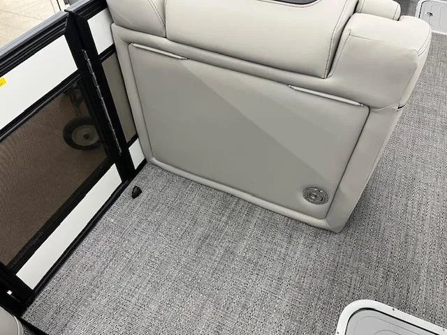 Slide: The Image of 2025 Barletta Lusso 25UC interior with gray upholstery and carpet flooring. - 9