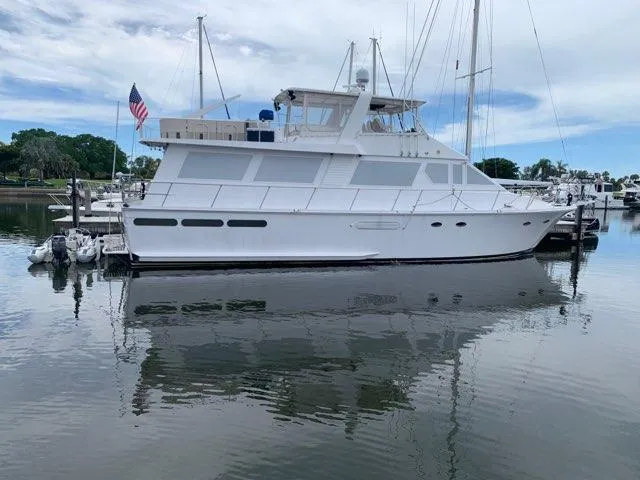Slide: The Image of 1988 Viking Motor Yacht docked in a marina. - 0
