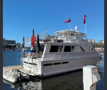 Slide: The Image of 1988 Viking Motor Yacht docked at marina on a sunny day. - 10