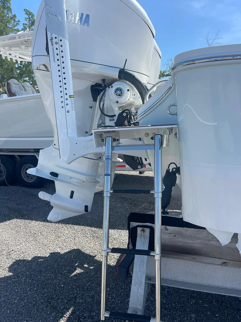 Slide: The Image of 2026 Regulator 30XO boat with Yamaha outboard motor and ladder. - 17