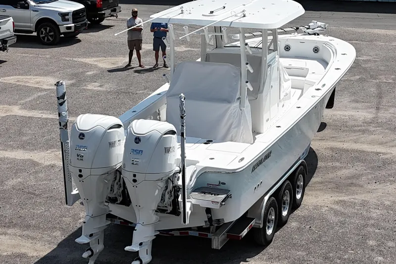 Slide: The Image of 2026 Regulator 30XO boat with dual Yamaha engines on a trailer. - 18