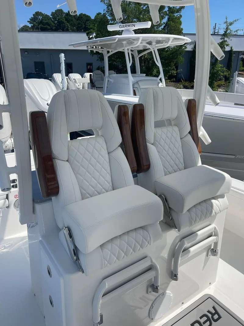Slide: The Image of Luxurious seating on 2026 Regulator 30XO boat with white quilted upholstery. - 8