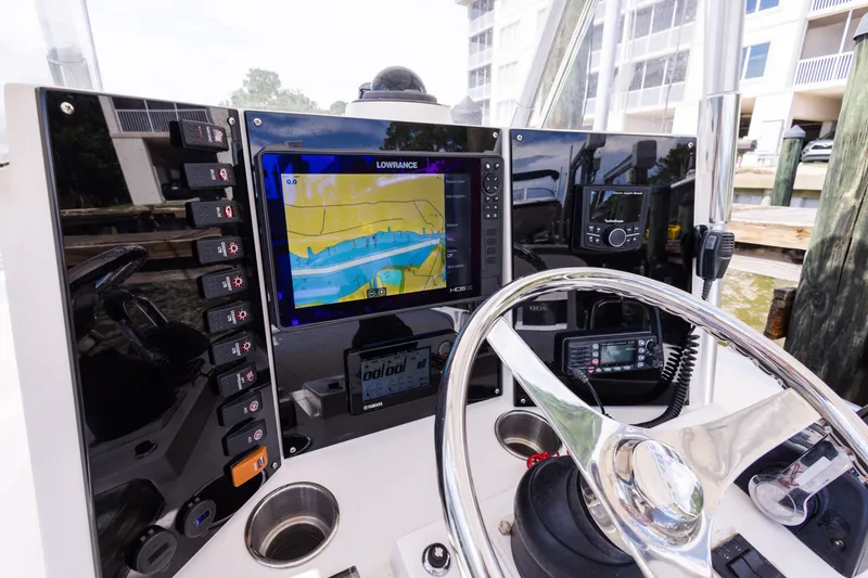 Slide: The Image of Control panel of a 1999 Island Runner 31 boat with navigation equipment. - 15