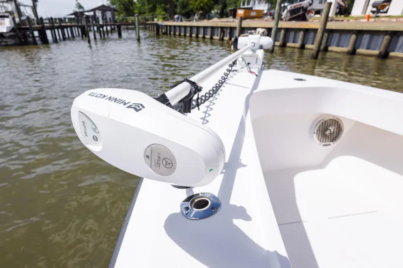 Slide: The Image of Minn Kota trolling motor on 1999 Island Runner 31 boat, dockside view. - 22