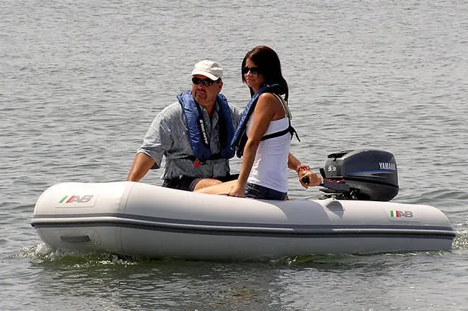 Slide: The Image of 2025 AB Inflatables Lammina 9 UL boat with two people on water. - 2