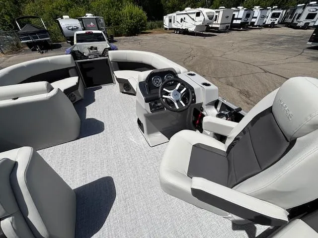 Slide: The Image of Interior of 2025 Harris Cruiser 190 boat with modern seating and steering console. - 12