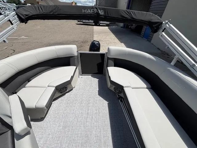 Slide: The Image of 2025 Harris Cruiser 190 pontoon boat with spacious seating and sleek design. - 14