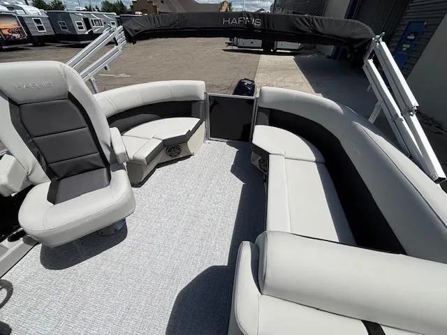 Slide: The Image of 2025 Harris Cruiser 190 pontoon boat interior with plush seating and modern design. - 15