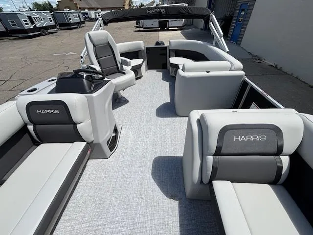 Slide: The Image of 2025 Harris Cruiser 190 pontoon boat with spacious seating and modern design. - 17