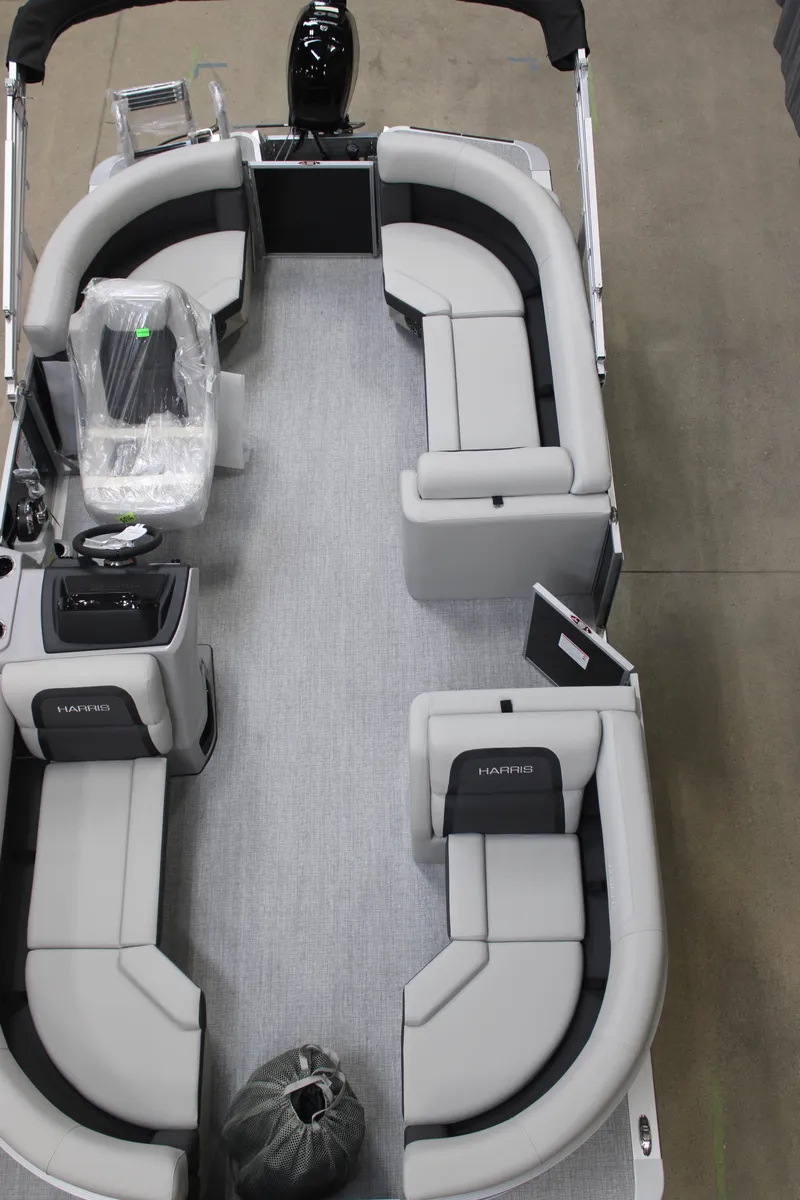 Slide: The Image of 2025 Harris Cruiser 190 pontoon boat interior with gray seating and modern design. - 7