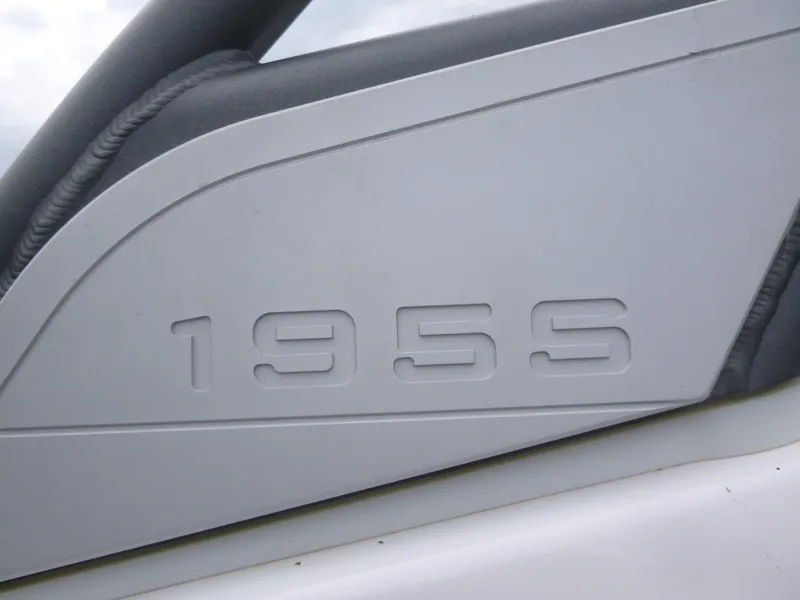 Slide: The Image of Close-up of 2020 Yamaha Boats 195S model logo on white surface. - 12