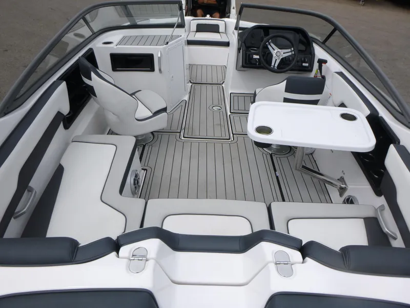 Slide: The Image of 2020 Yamaha Boats 195S interior with seating, table, and steering console. - 5