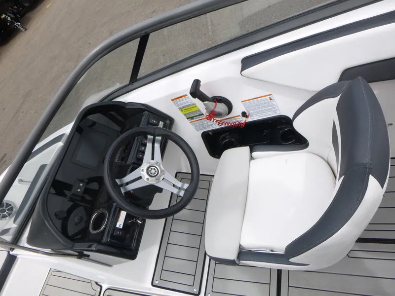 Slide: The Image of 2020 Yamaha Boats 195S cockpit with steering wheel and captain's chair. - 7