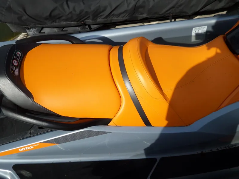 Slide: The Image of 2021 Sea-Doo GTI SE 170 with vibrant orange seat and Rotax engine branding. - 14