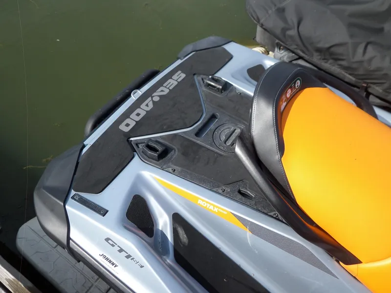 Slide: The Image of 2021 Sea-Doo GTI SE 170 jet ski with orange seat and Rotax engine. - 15