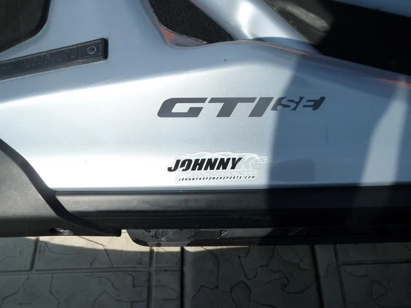 Slide: The Image of 2021 Sea-Doo GTI SE 170 watercraft with Johnny K's Powersports branding. - 16