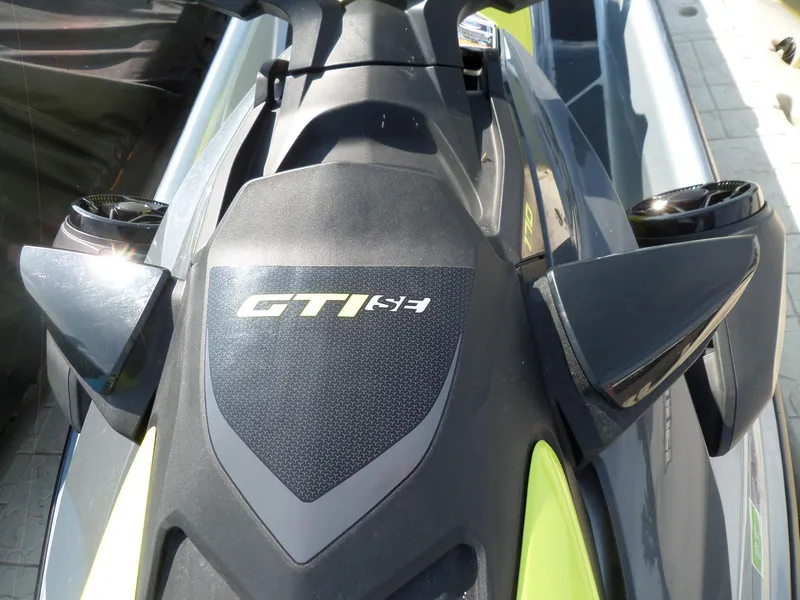 Slide: The Image of 2021 Sea-Doo GTI SE 170 jet ski, close-up of sleek design and logo. - 7