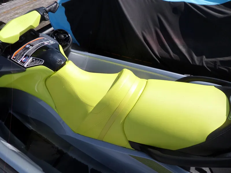 Slide: The Image of 2021 Sea-Doo GTI SE 170 jet ski with bright yellow seat and handlebars. - 9
