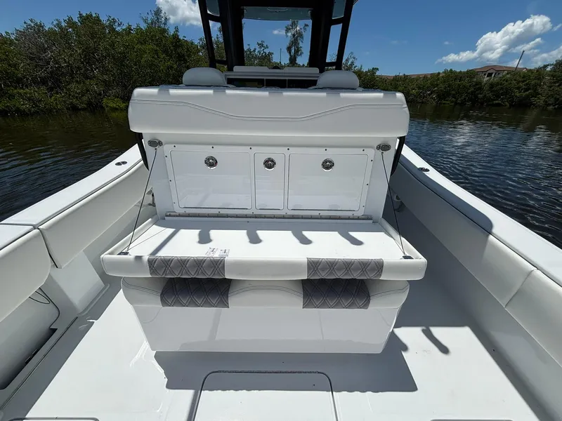 Slide: The Image of 2026 Invincible 36 Open Fisherman boat interior with seating and storage compartments. - 12