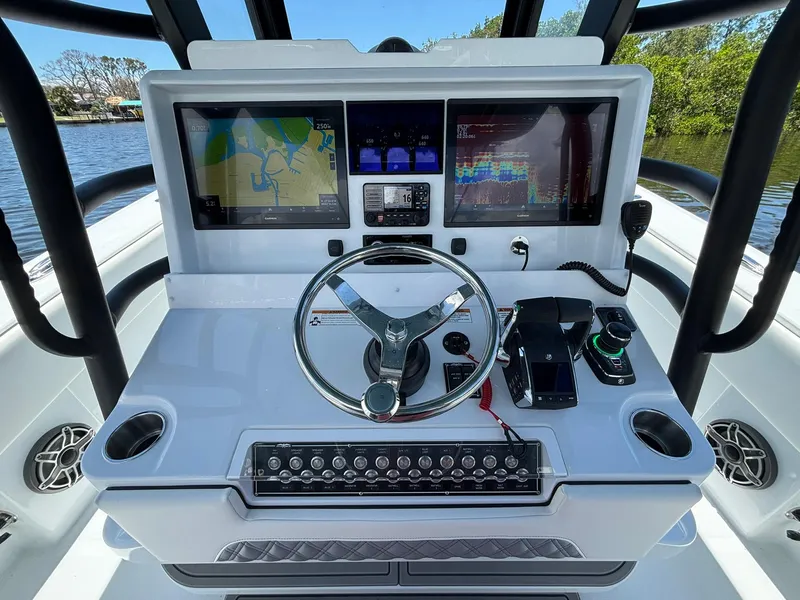 Slide: The Image of 2026 Invincible 36 Open Fisherman boat dashboard with advanced navigation and control systems. - 15