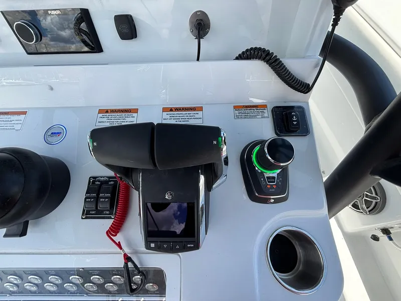 Slide: The Image of Control panel of 2026 Invincible 36 Open Fisherman boat with modern navigation equipment. - 16