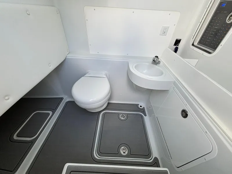 Slide: The Image of 2026 Invincible 36 Open Fisherman boat bathroom with toilet and sink. - 20
