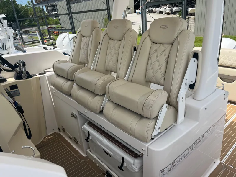 Slide: The Image of 2019 Regal 33 SAV boat with three luxurious beige seats and modern interior design. - 24