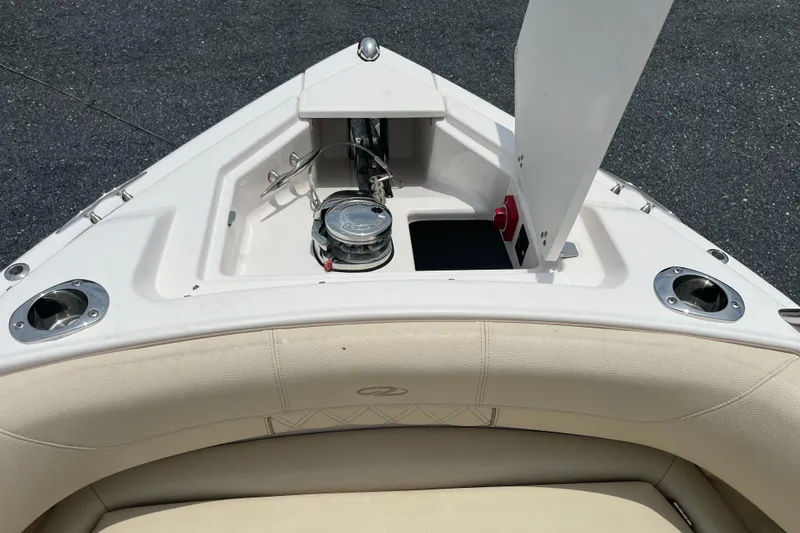 Slide: The Image of 2019 Regal 33 SAV boat bow with anchor storage and seating area. - 36