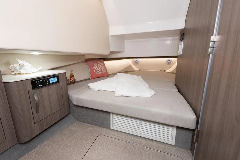 Slide: The Image of Manufacturer Provided Image: 2019 Regal 33 SAV cabin interior with bed, storage, and modern amenities. - 39