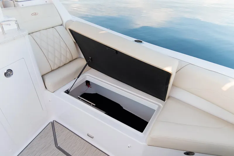 Slide: The Image of Manufacturer Provided Image: Open storage compartment on a 2019 Regal 33 SAV boat with cushioned seating. - 40