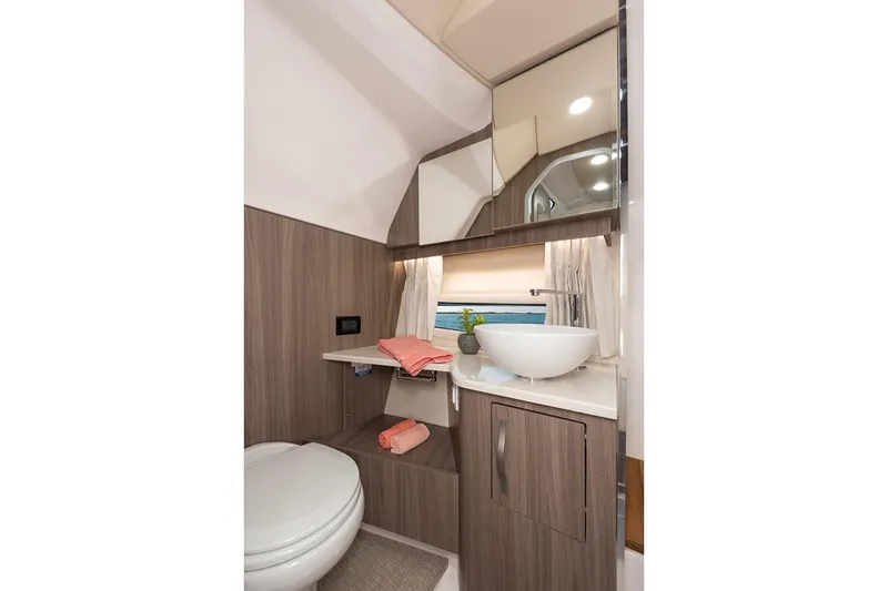 Slide: The Image of Manufacturer Provided Image: Modern bathroom in 2019 Regal 33 SAV boat with sink, toilet, and storage. - 42