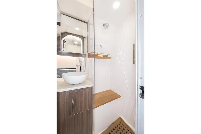Slide: The Image of Manufacturer Provided Image: 2019 Regal 33 SAV boat bathroom with modern sink and shower. - 43