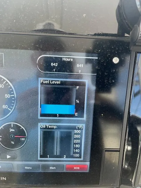 Slide: The Image of 2019 Regal 33 SAV dashboard showing fuel level, oil temperature, and engine hours. - 9