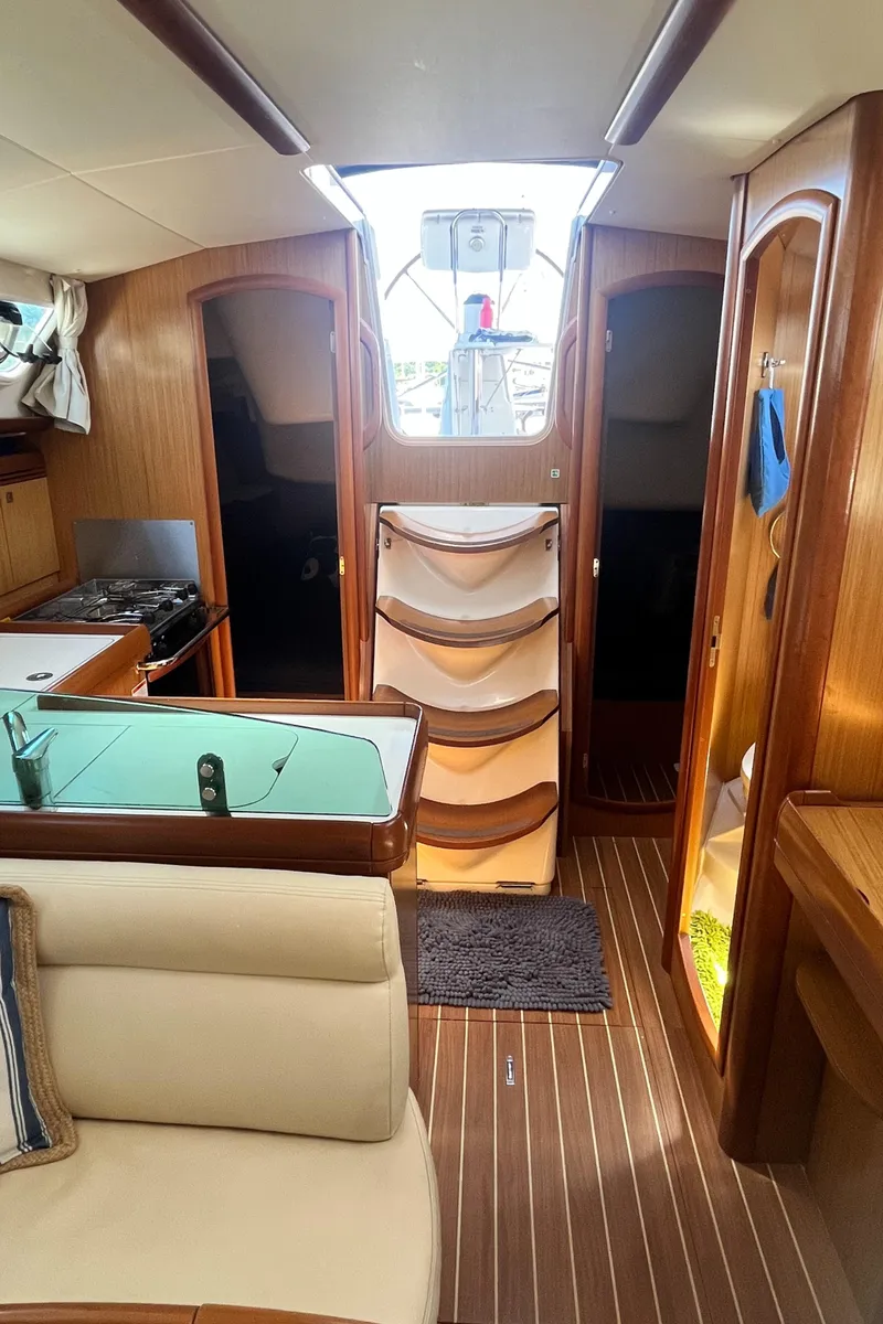Slide: The Image of Interior of 2008 Jeanneau Sun Odyssey 36i sailboat, featuring wood finish and modern amenities. - 13