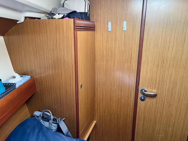 Slide: The Image of Interior of 2008 Jeanneau Sun Odyssey 36i yacht with wooden cabinetry and storage. - 19