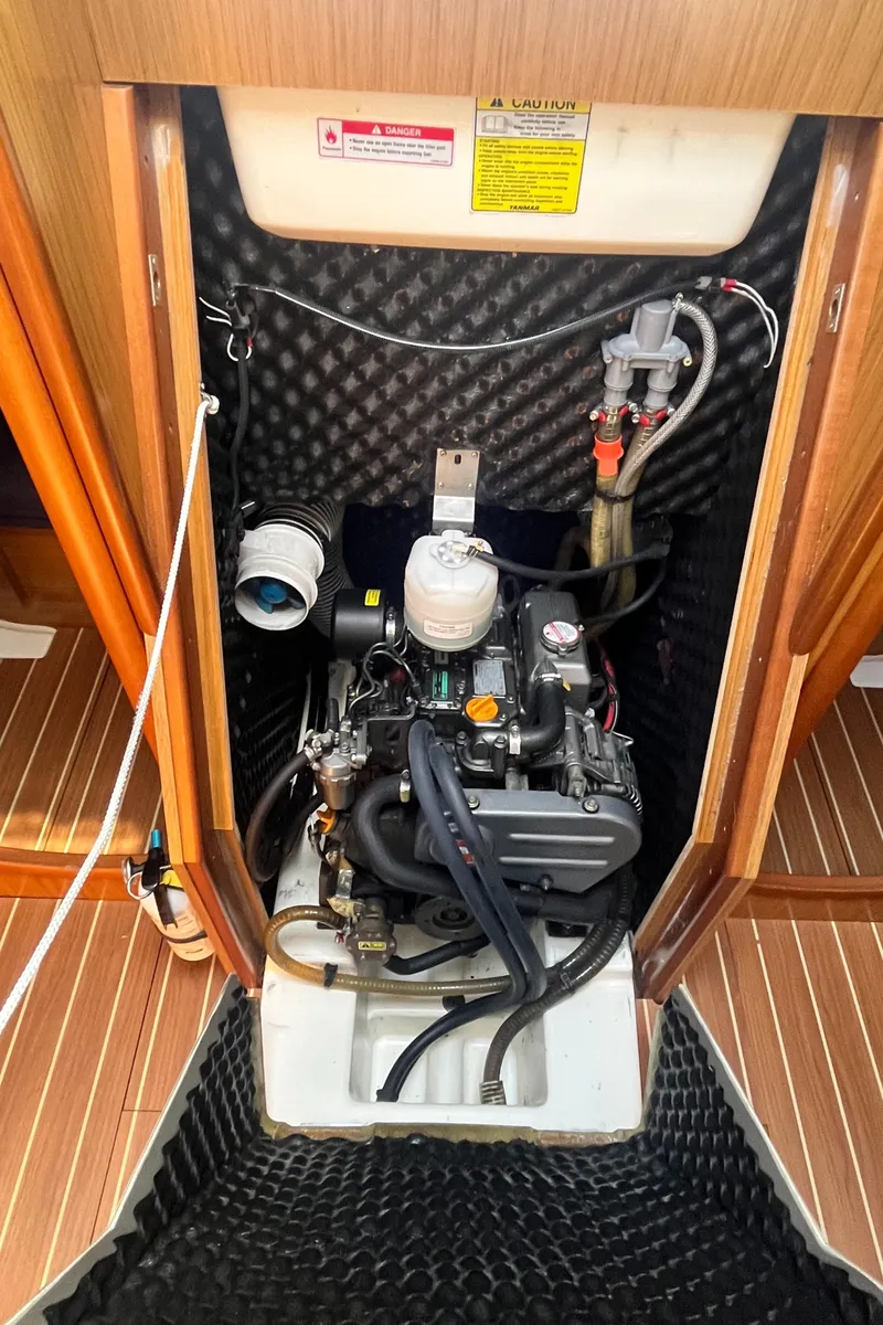 Slide: The Image of Engine compartment of 2008 Jeanneau Sun Odyssey 36i sailboat, showcasing detailed mechanical components. - 21