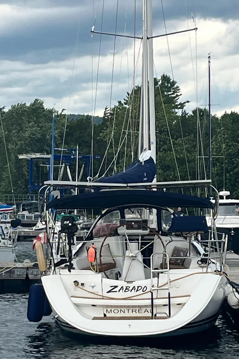 Slide: The Image of Jeanneau Sun Odyssey 36i sailboat docked, 2008 model, named Zabado, in a marina setting. - 5