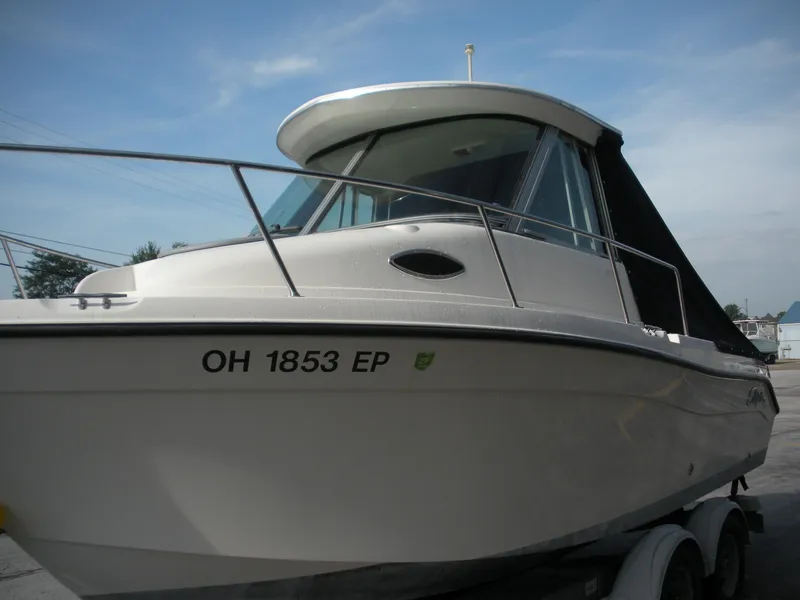 Slide: The Image of 2008 Seaswirl Striper 2101 Alaskan boat on trailer, side view. - 3