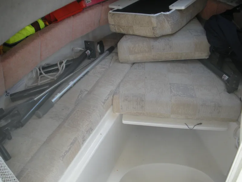 Slide: The Image of Interior of 2008 Seaswirl Striper 2101 Alaskan boat with cushions and storage. - 5