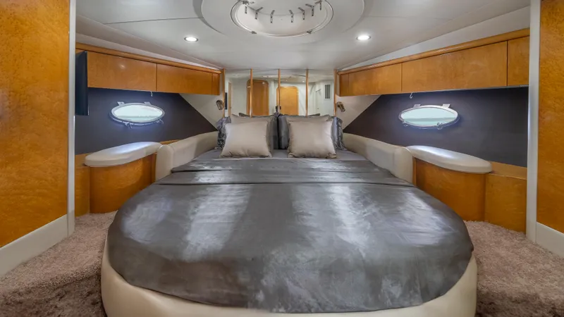 Slide: The Image of Luxurious bedroom interior of 1999 Sunseeker Predator 58 yacht with elegant design. - 11