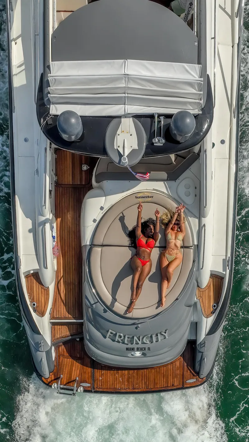Slide: The Image of Aerial view of 1999 Sunseeker Predator 58 yacht with two people sunbathing. - 15