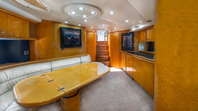 Slide: The Image of Luxurious interior of 1999 Sunseeker Predator 58 yacht with elegant wood finishes and modern lighting. - 17