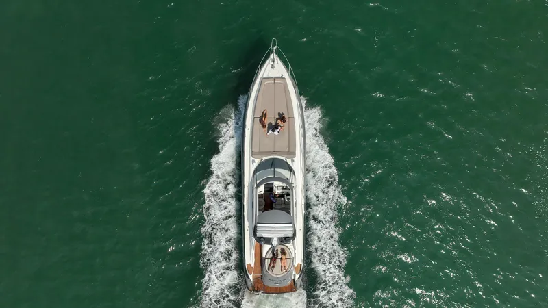 Slide: The Image of Aerial view of 1999 Sunseeker Predator 58 yacht cruising on open water. - 40