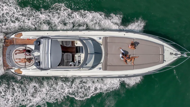 Slide: The Image of Aerial view of 1999 Sunseeker Predator 58 yacht cruising on the water. - 43